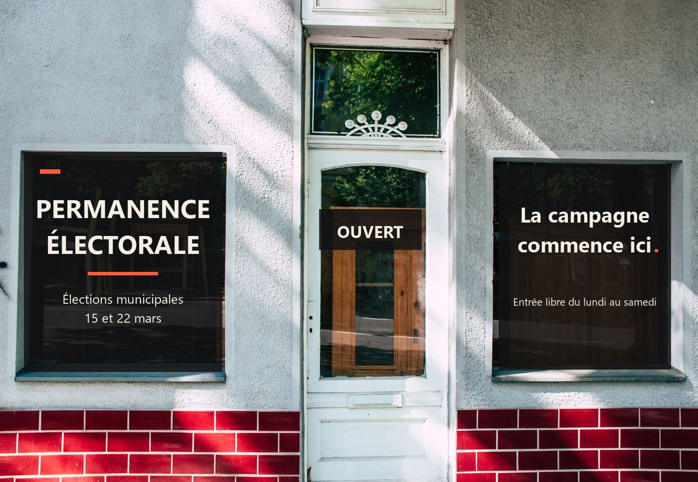Vitrine d'un local commercial en rez-de-chaussée, typique d'une permanence de campagne